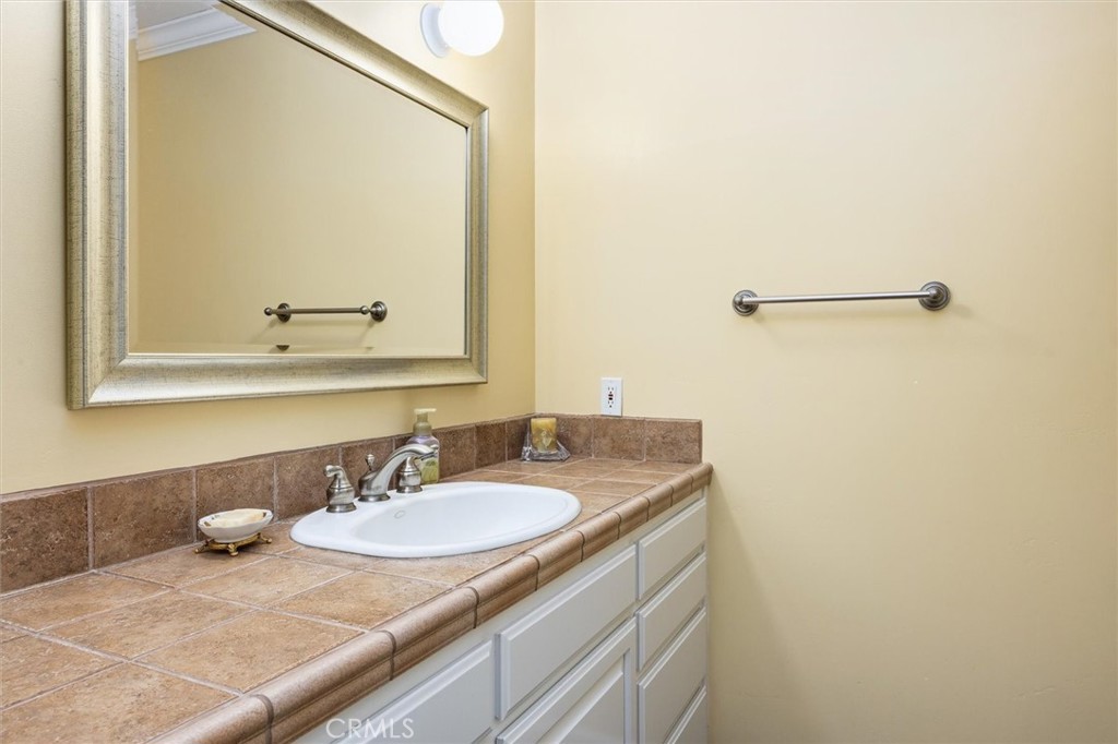1985 Penman Springs Road Paso Robles, CA 93446 - Photo 30 of 65 a bathroom with a sink and a mirror