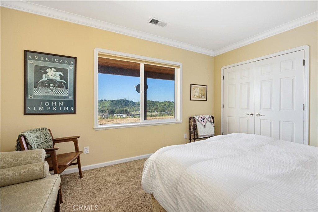 1985 Penman Springs Road Paso Robles, CA 93446 - Photo 31 of 65 a bedroom with a bed and a window