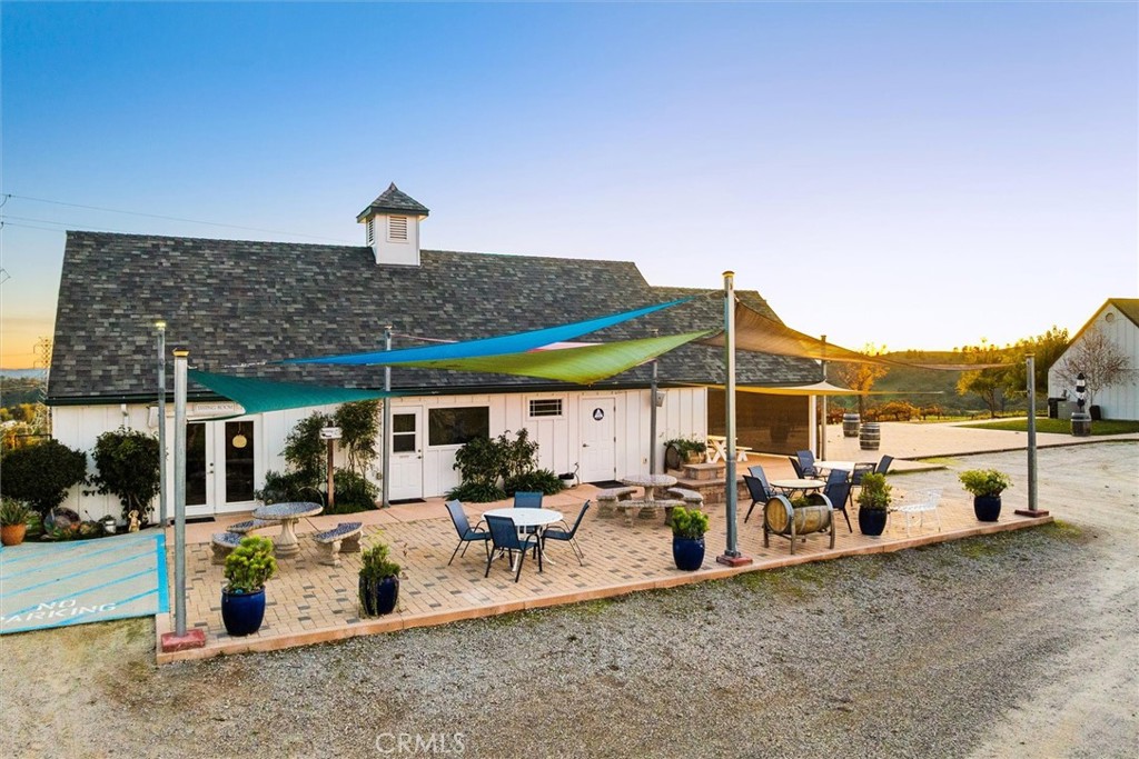 1985 Penman Springs Road Paso Robles, CA 93446 - Photo 4 of 65 a view of a patio with table and chairs under an umbrella