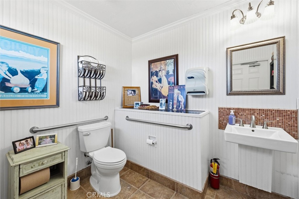 1985 Penman Springs Road Paso Robles, CA 93446 - Photo 44 of 65 a bathroom with a toilet a sink and mirror
