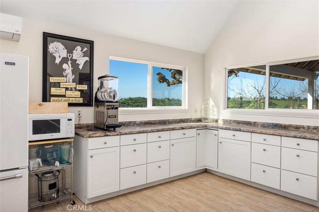 1985 Penman Springs Road Paso Robles, CA 93446 - Photo 45 of 65 a kitchen with granite countertop a sink cabinets and window