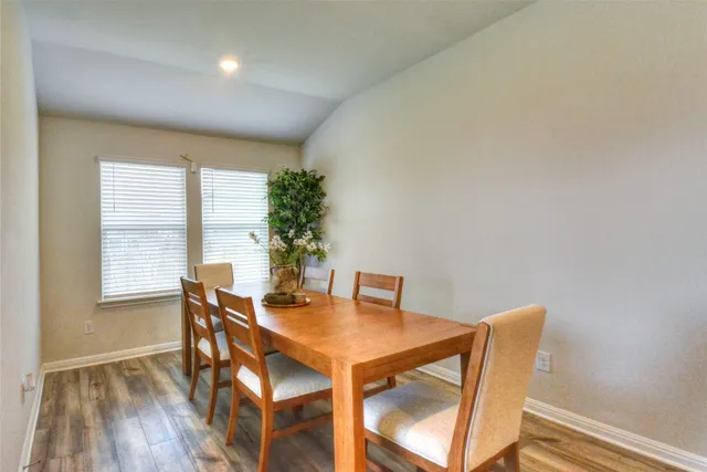 a room with furniture and a potted plant