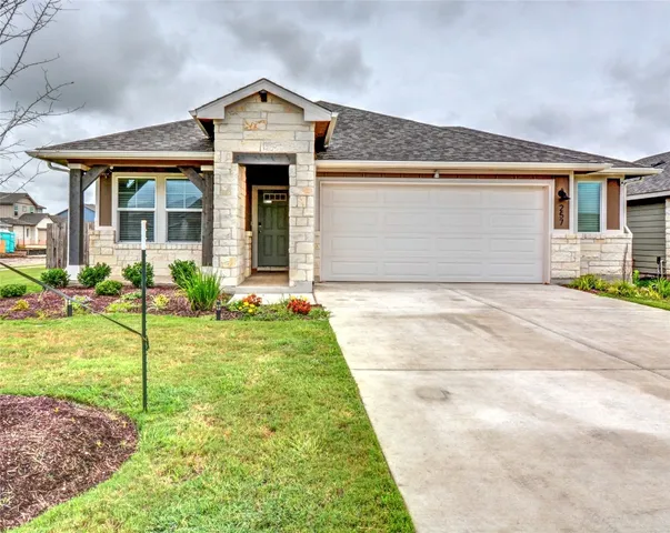 a front view of house with yard