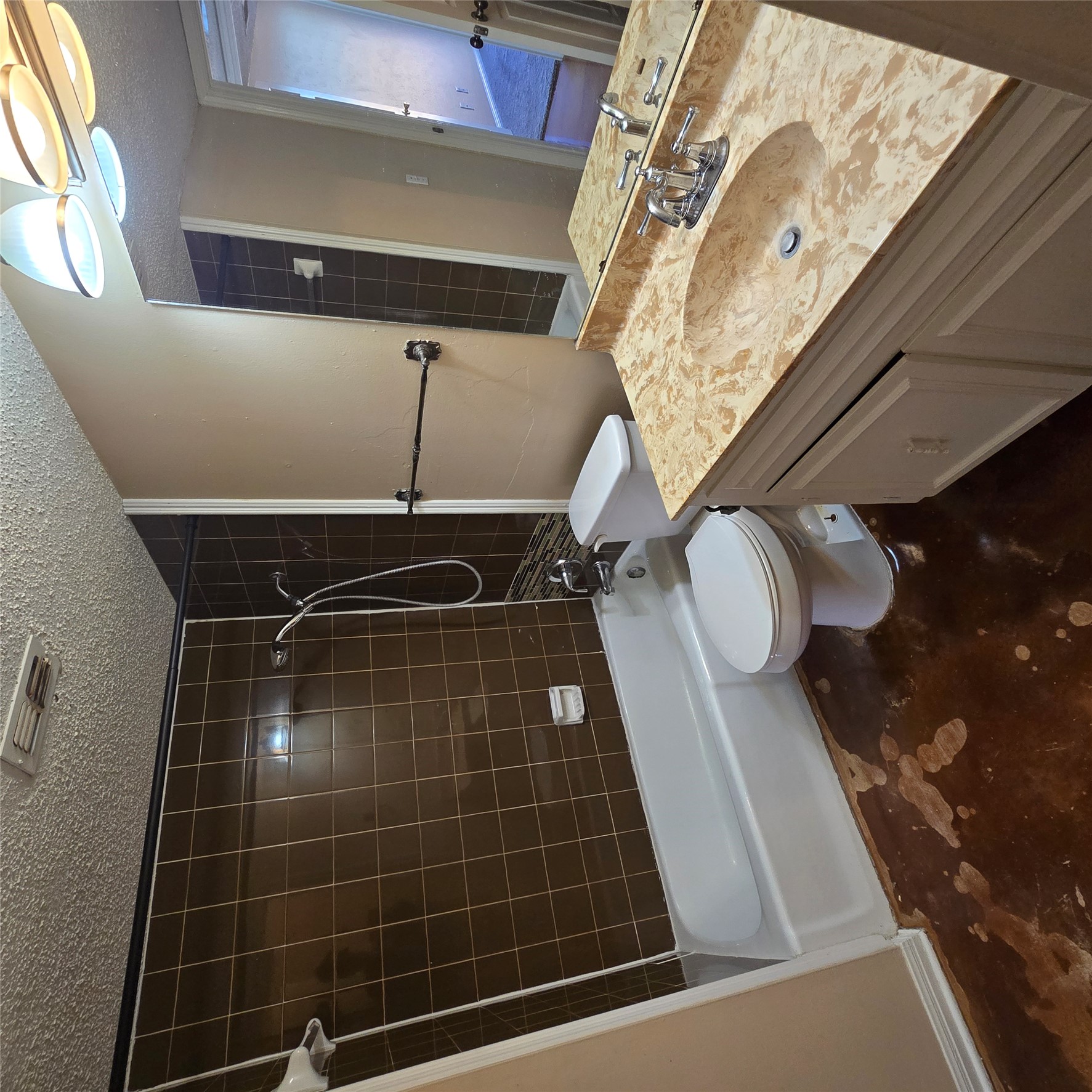 801 Ranch Road 12 San Marcos, TX 78666 - Photo 12 of 21 Bathroom with vanity, shower / bath combination, and a textured ceiling