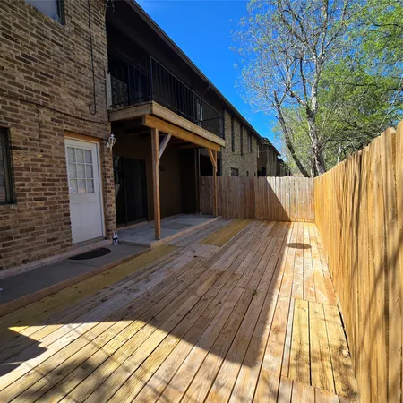 a view of a house with a wooden stairs