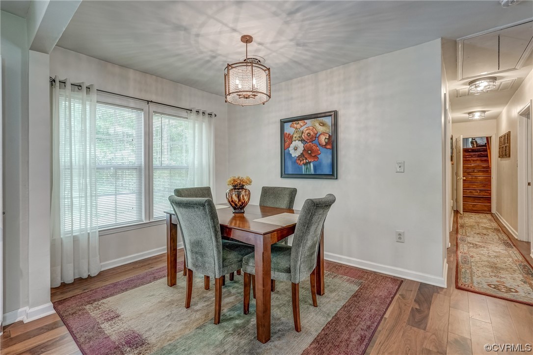 3453 Blackstone Road Kenbridge, VA 23944 - Photo 12 of 49 a view of a dining room with furniture wooden floor and a chandelier