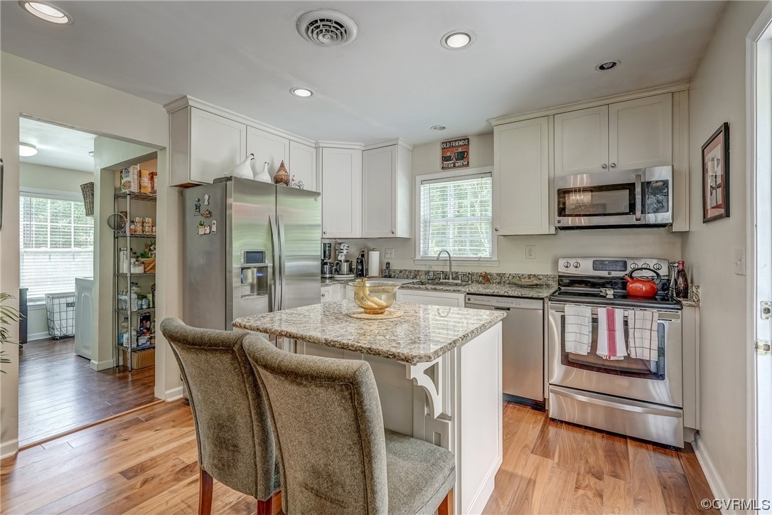 3453 Blackstone Road Kenbridge, VA 23944 - Photo 14 of 49 a kitchen with stainless steel appliances granite countertop a refrigerator a stove top oven a sink and dishwasher