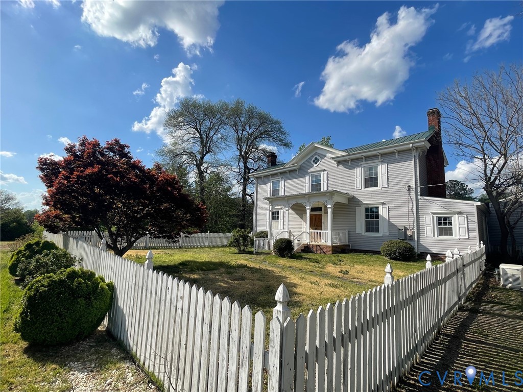 a view of house with backyard and entertaining space