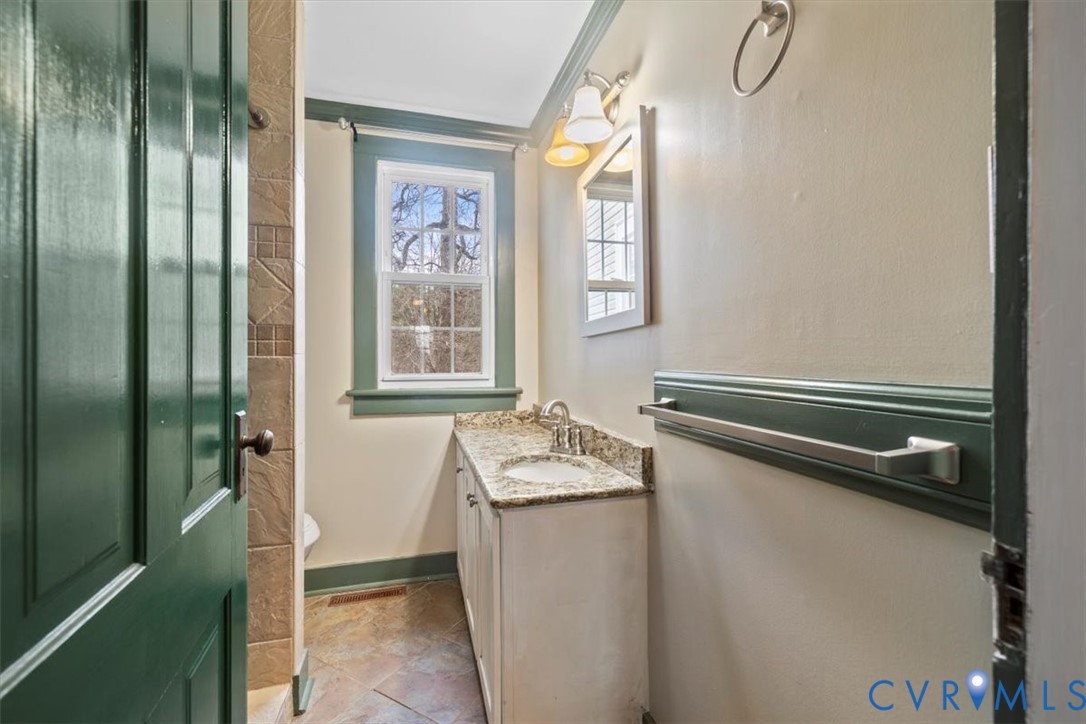 2297 Indian Oak Road Crewe, VA 23930 - Photo 30 of 46 a bathroom with a granite countertop sink and a mirror