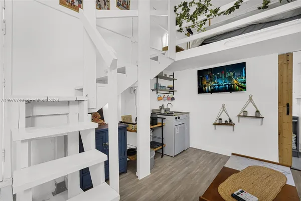 a living room with furniture and a table