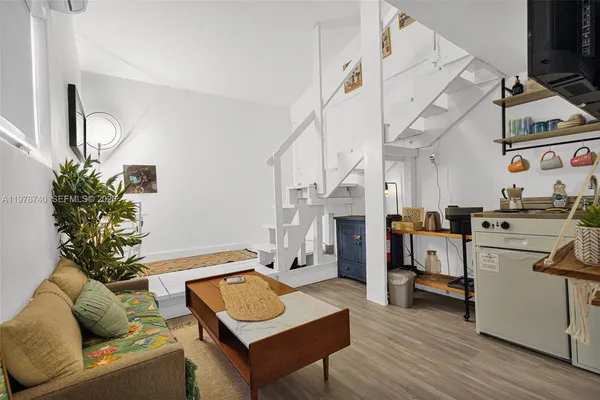 a bathroom with a toilet a sink and a mirror