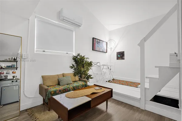 a bathroom with a toilet a sink and a mirror