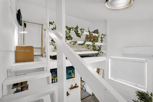 a kitchen with stainless steel appliances granite countertop a refrigerator a stove top oven a sink and dishwasher