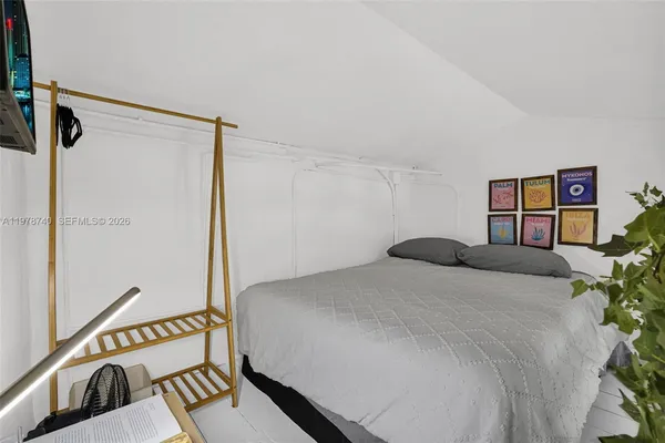 a living room with furniture a table and wooden floor