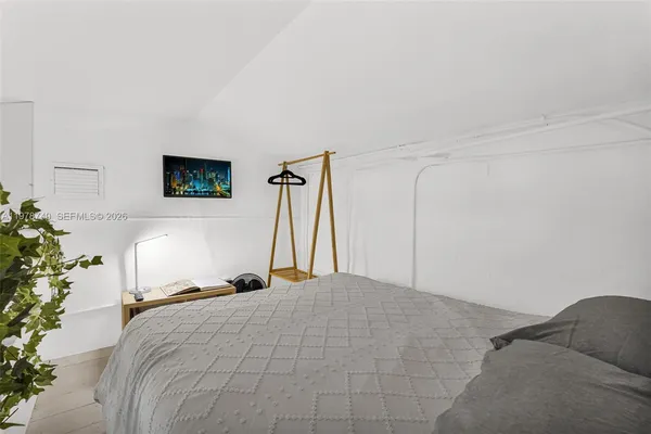 a kitchen with stainless steel appliances kitchen island granite countertop a stove top oven a sink a dining table and chairs