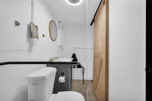 a view of a hallway with washer and dryer