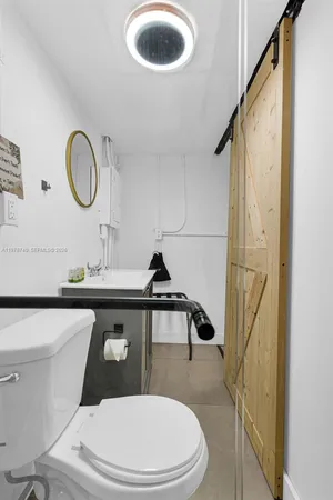 a view of a bedroom with washer and dryer