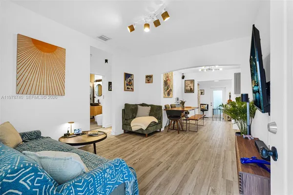 a living room with furniture and a flat screen tv