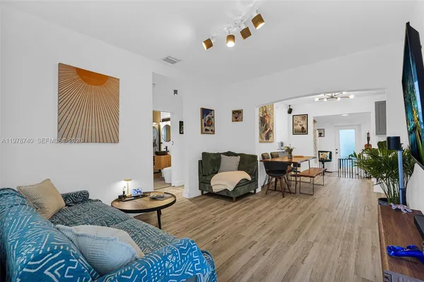 a living room with furniture and a flat screen tv