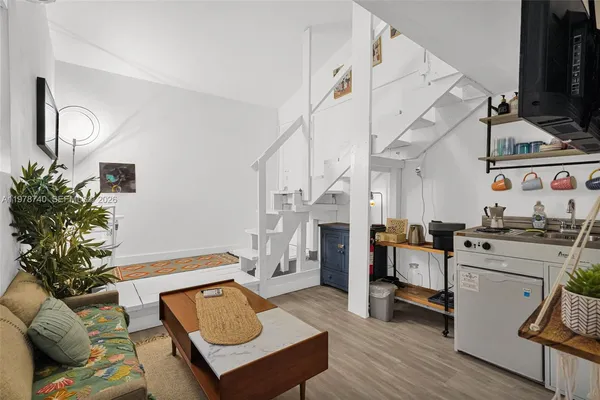 a view of living room with furniture and fireplace