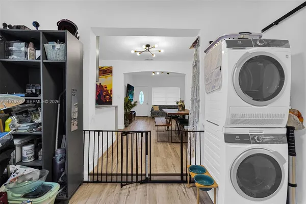 a view of a patio with couches table and chairs and potted plants