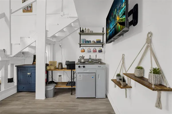 a view of bathroom with a potted plant on the wall and a potted plant