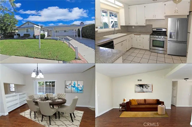 a living room with furniture and a kitchen