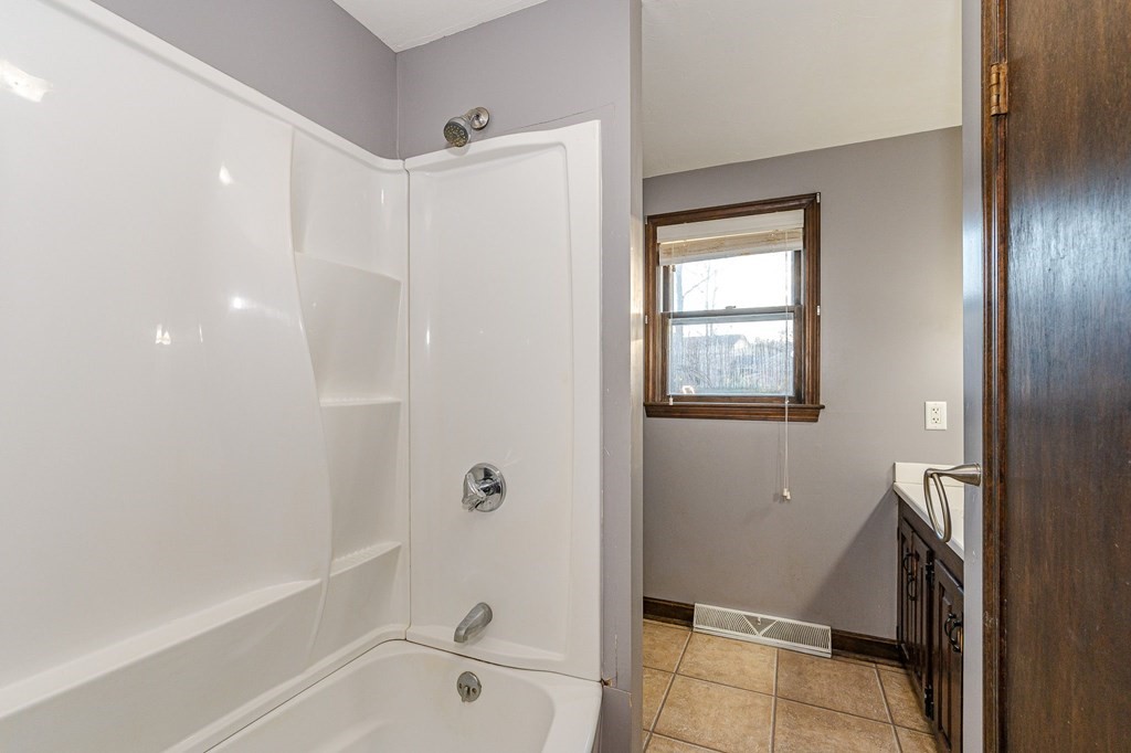 29 Emery Road Townsend, MA 01469 - Photo 14 of 25 a bathroom with a bathtub and a shower