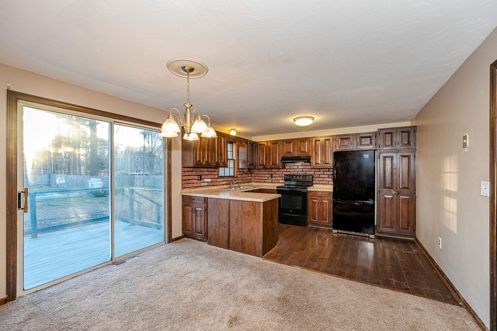 29 Emery Road Townsend, MA 01469 - Photo 2 of 25 a kitchen with refrigerator and window