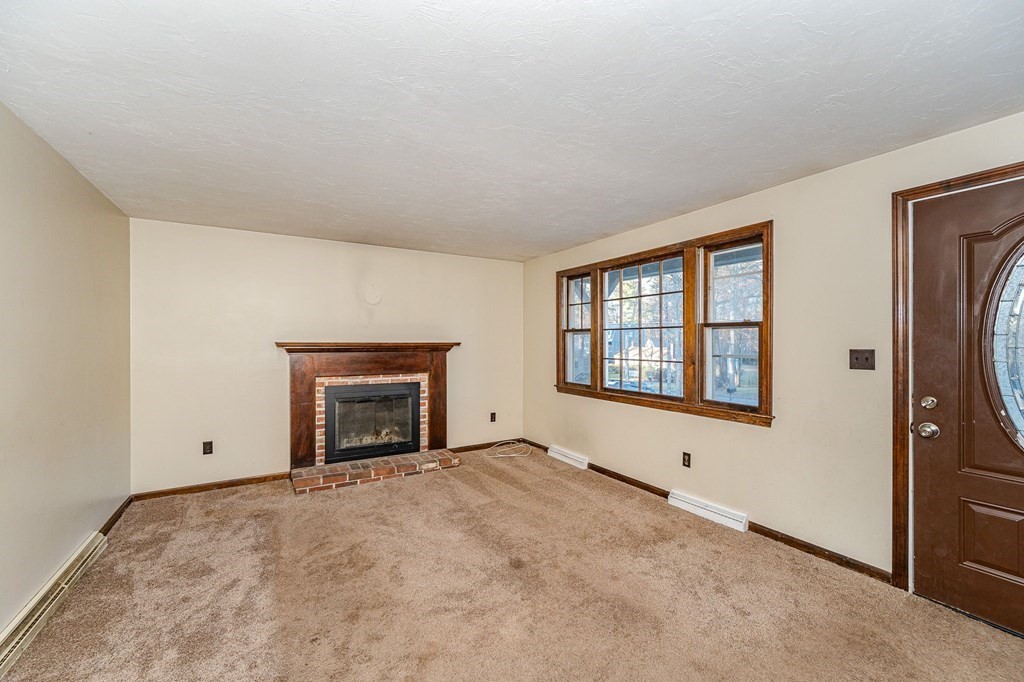 29 Emery Road Townsend, MA 01469 - Photo 6 of 25 a view of empty room with a fireplace