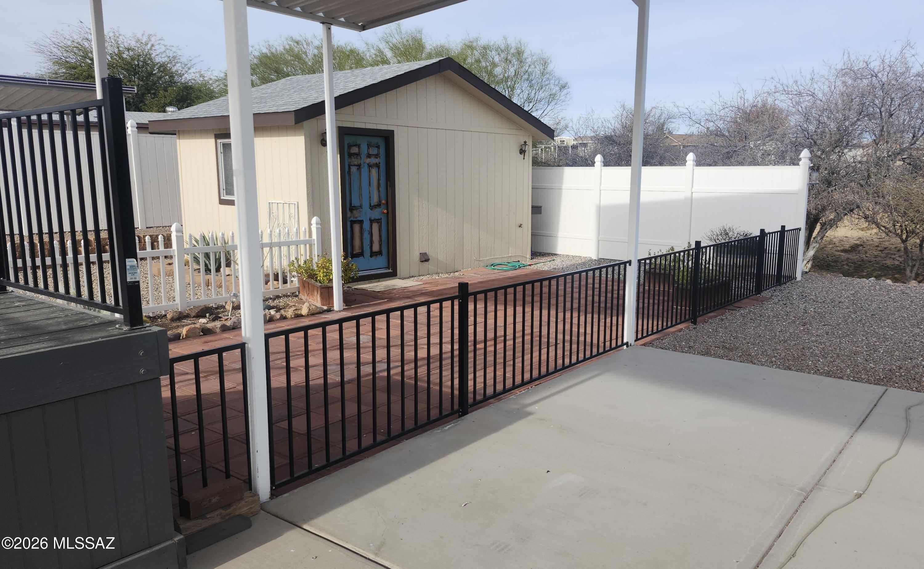 1030 Barrel Cactus Ridge, Unit 28 Benson, AZ 85602 - Photo 2 of 6 Shed and fencing