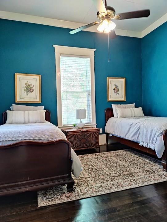 617 South 12th Street Waco, TX 76706 - Photo 14 of 27 a bedroom with two beds and a window