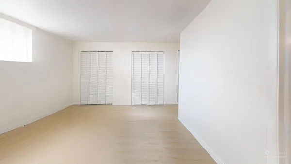 an empty room with windows