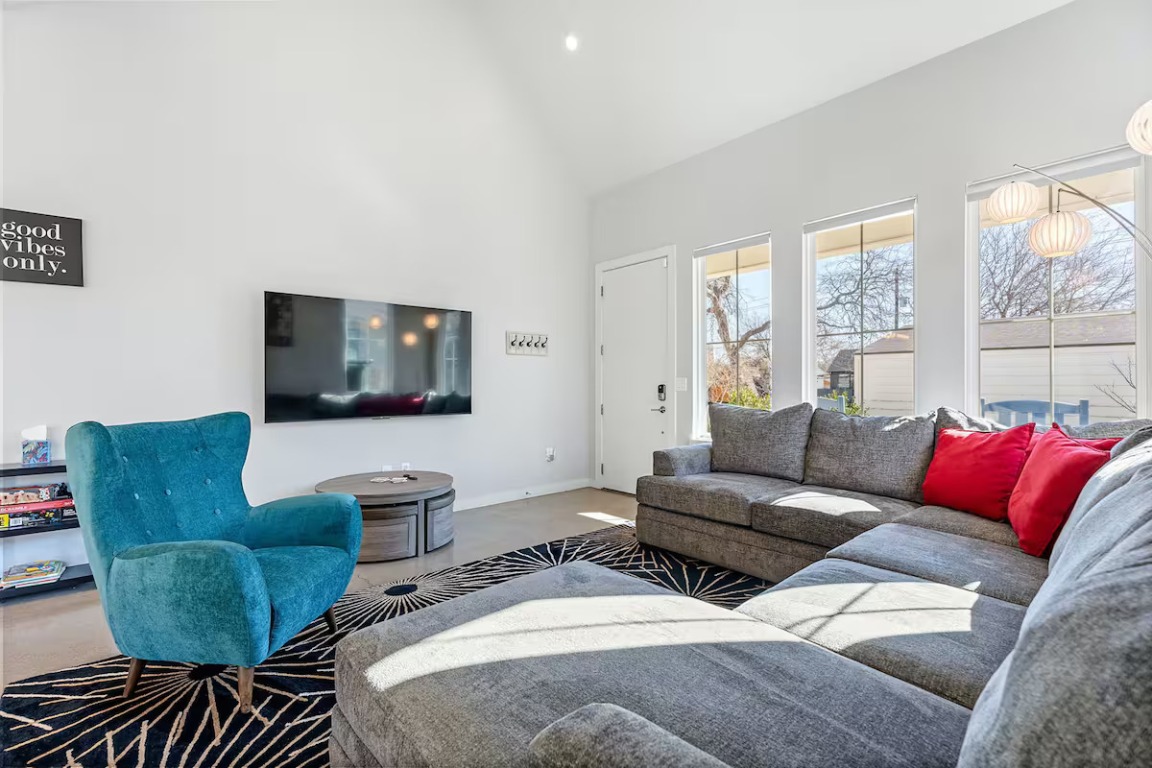 4314 Jinx Avenue, Unit A Austin, TX 78745 - Photo 11 of 40 a living room with furniture and a flat screen tv