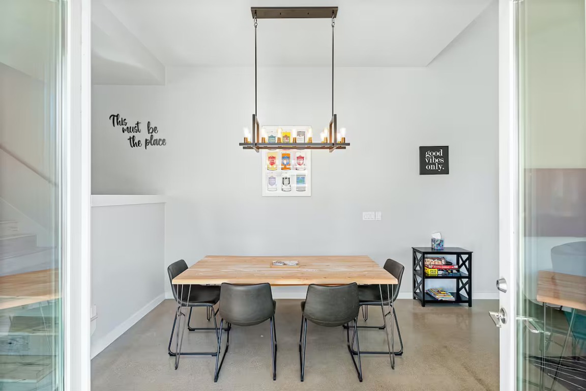 4314 Jinx Avenue, Unit A Austin, TX 78745 - Photo 20 of 40 Dining area with concrete flooring and a chandelier