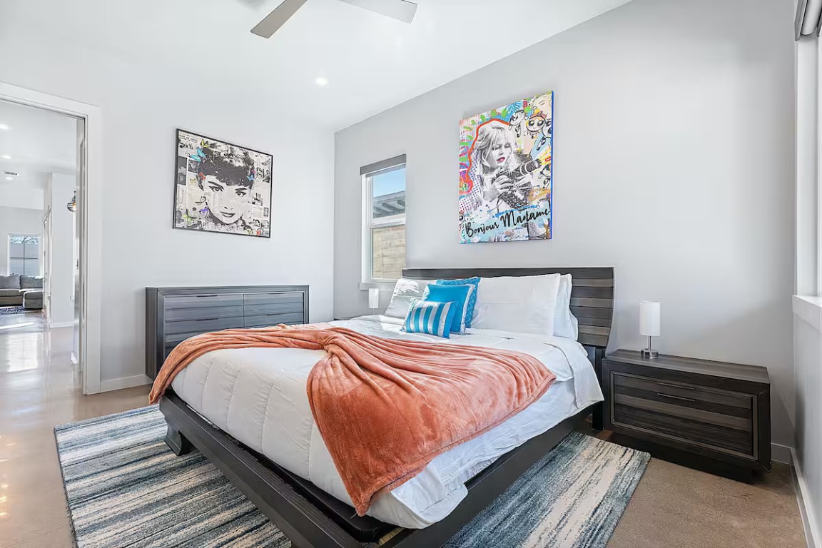 4314 Jinx Avenue, Unit A Austin, TX 78745 - Photo 26 of 40 a bedroom with a bed and a painting on the wall