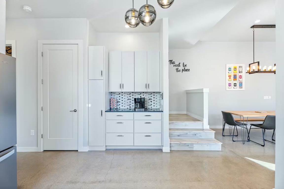 4314 Jinx Avenue, Unit A Austin, TX 78745 - Photo 31 of 40 a spacious bathroom with a granite countertop sink and a mirror