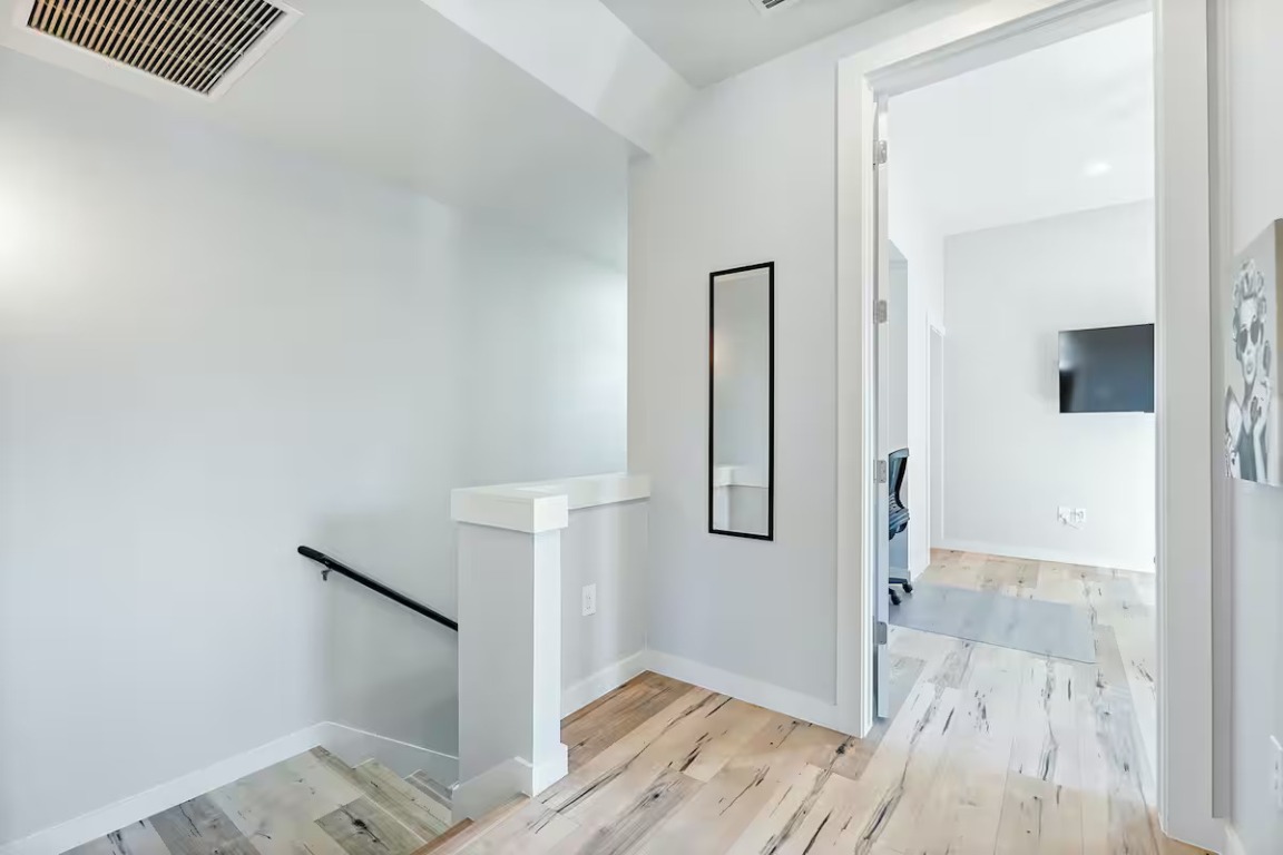 4314 Jinx Avenue, Unit A Austin, TX 78745 - Photo 32 of 40 a view of a hallway with wooden floor and entryway