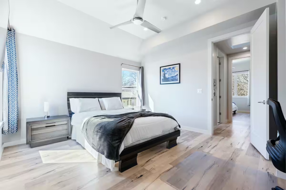 4314 Jinx Avenue, Unit A Austin, TX 78745 - Photo 35 of 40 a bedroom with a bed and a flat screen tv