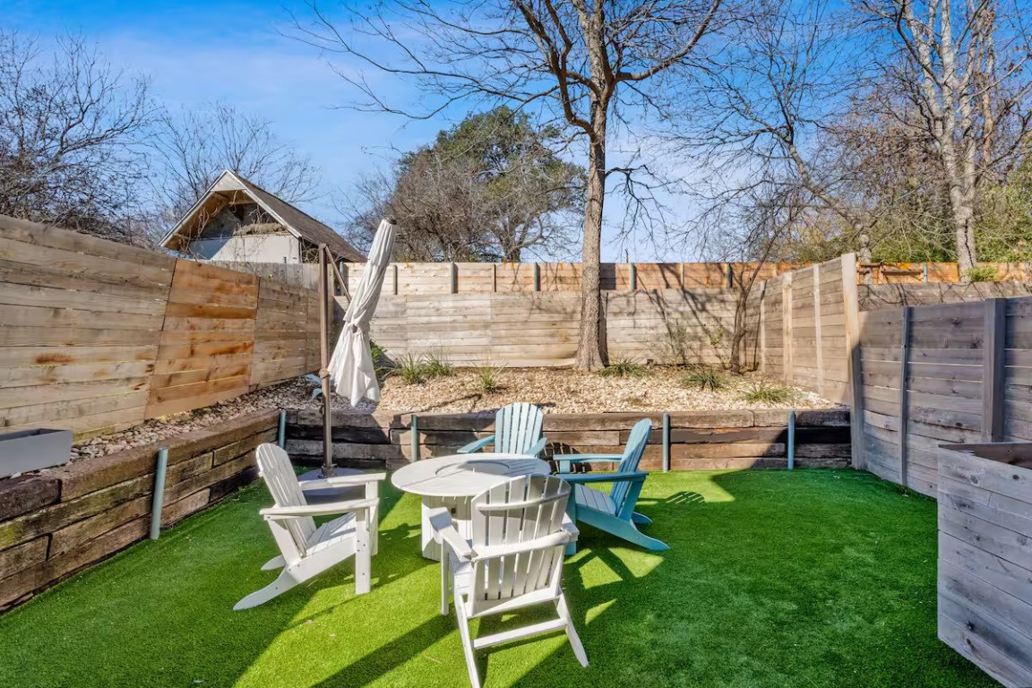 4314 Jinx Avenue, Unit A Austin, TX 78745 - Photo 8 of 40 Fenced backyard featuring an outdoor fire pit