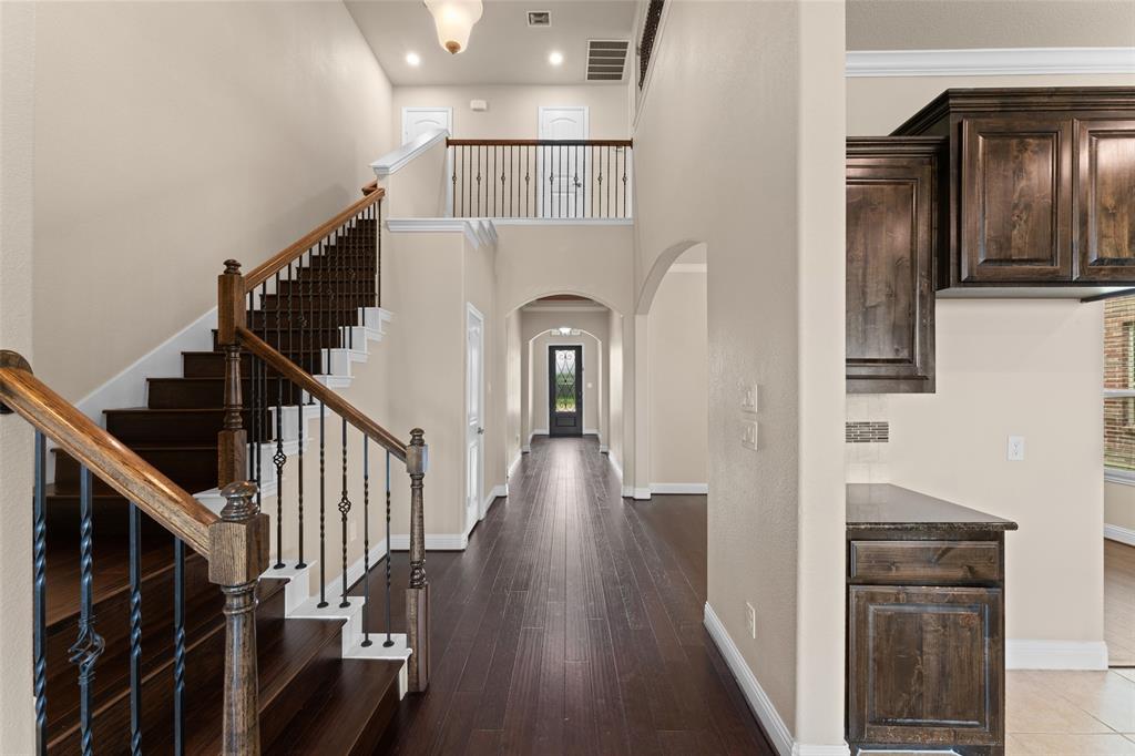 600 Fishback Circle Plano, TX 75074 - Photo 6 of 38 a view of entryway and hall with wooden floor