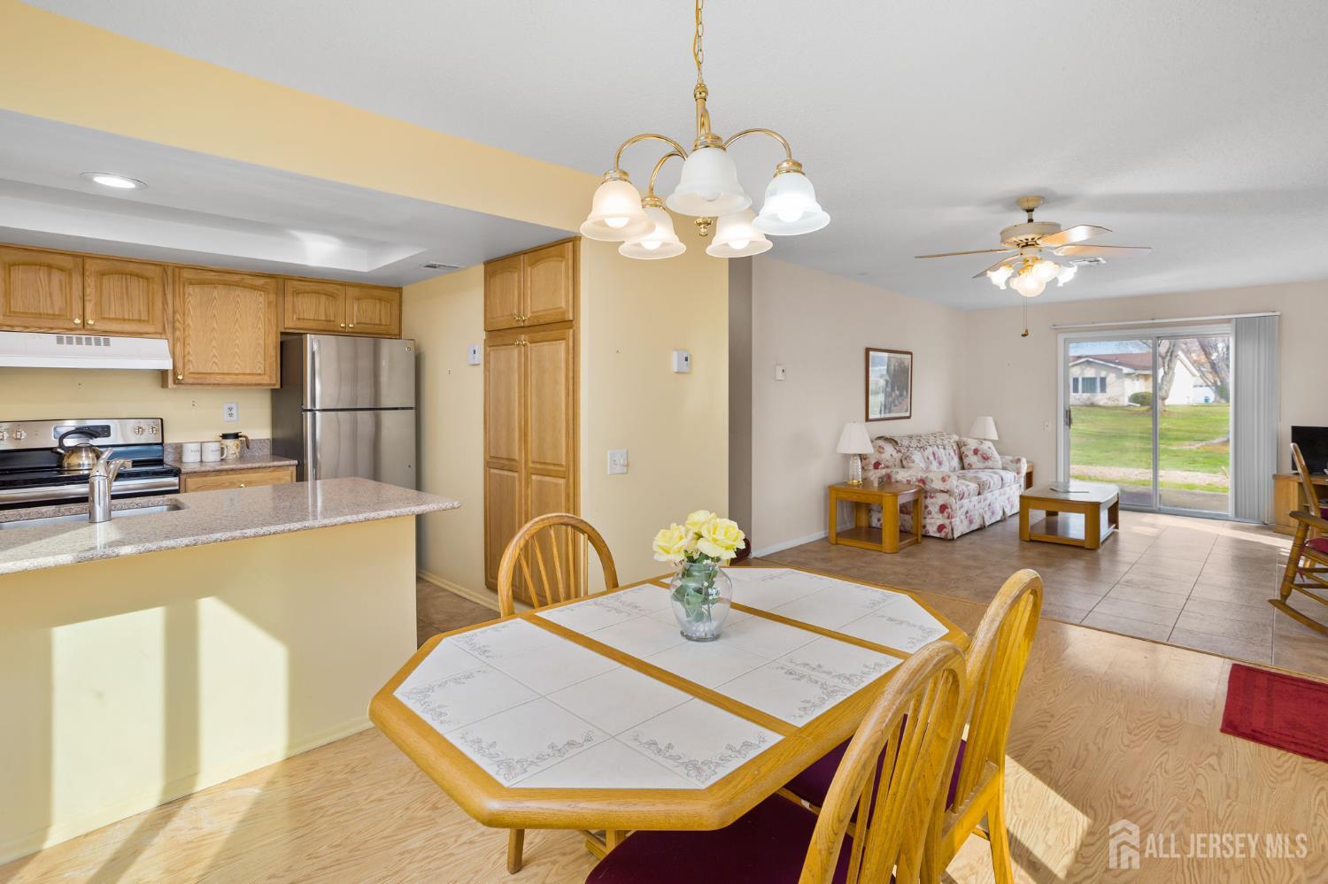274 Convent Road, Unit D Monroe Township, NJ 08831 - Photo 4 of 12 a view of a dining room with furniture window and outside view