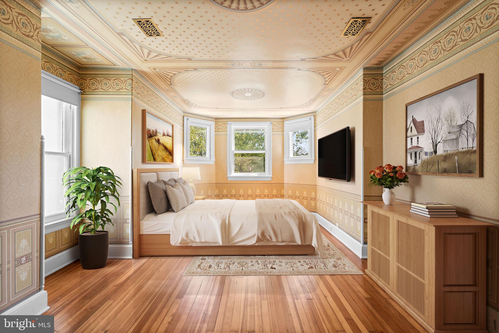 100 North Rolling Road Baltimore, MD 21228 - Photo 29 of 74 a spacious bedroom with a bed and a flat screen tv