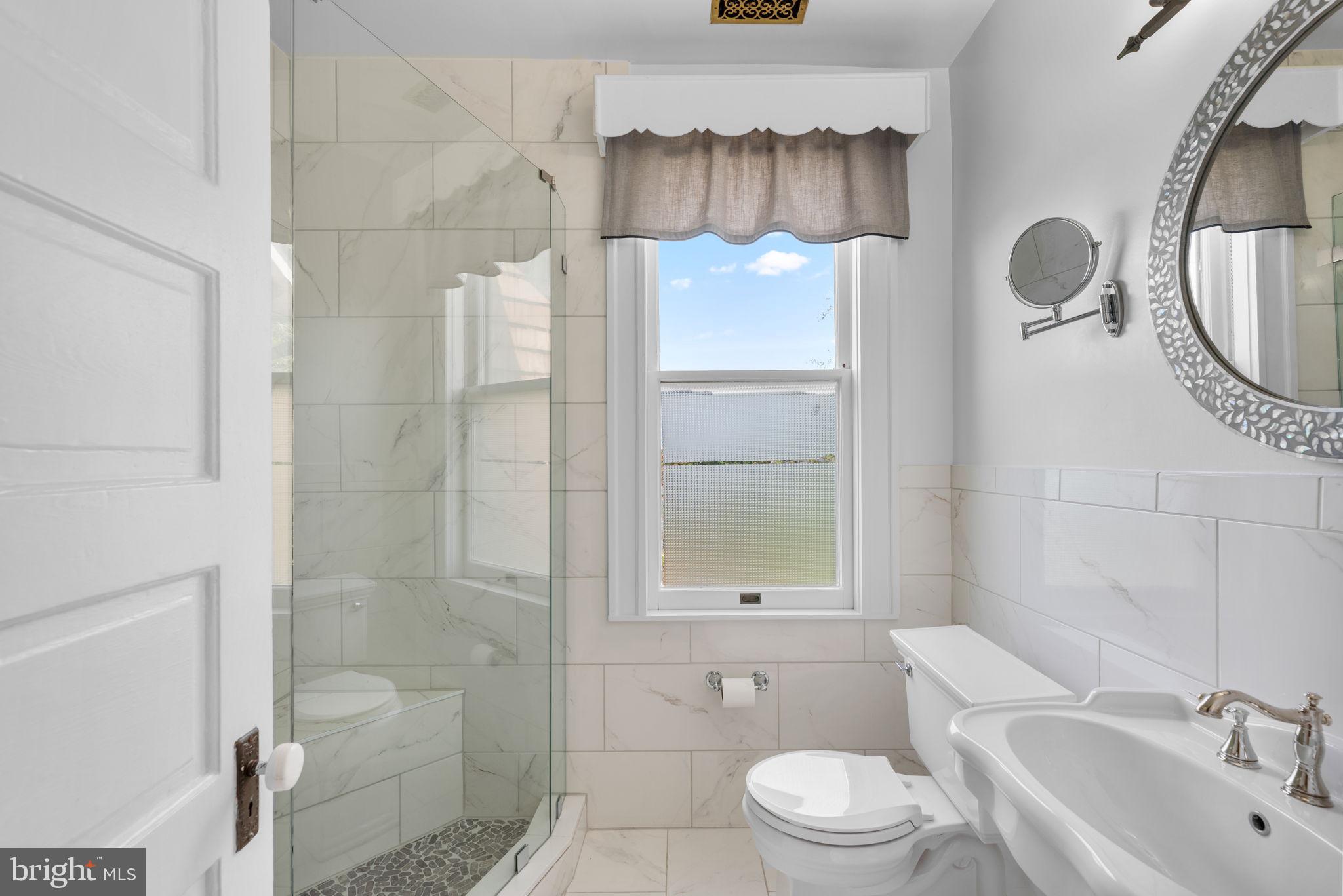 100 North Rolling Road Baltimore, MD 21228 - Photo 38 of 74 a bathroom with a sink toilet and shower