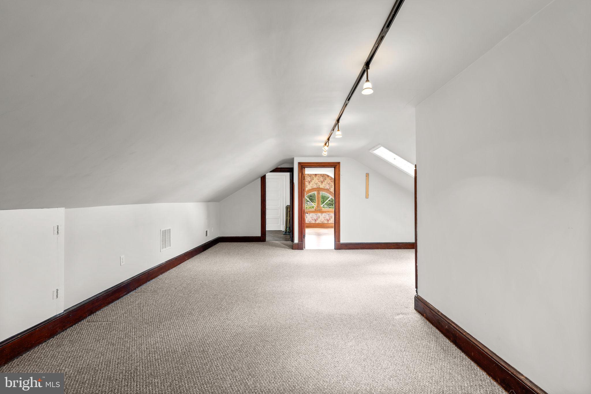 100 North Rolling Road Baltimore, MD 21228 - Photo 43 of 74 a view of a big room with closet and windows