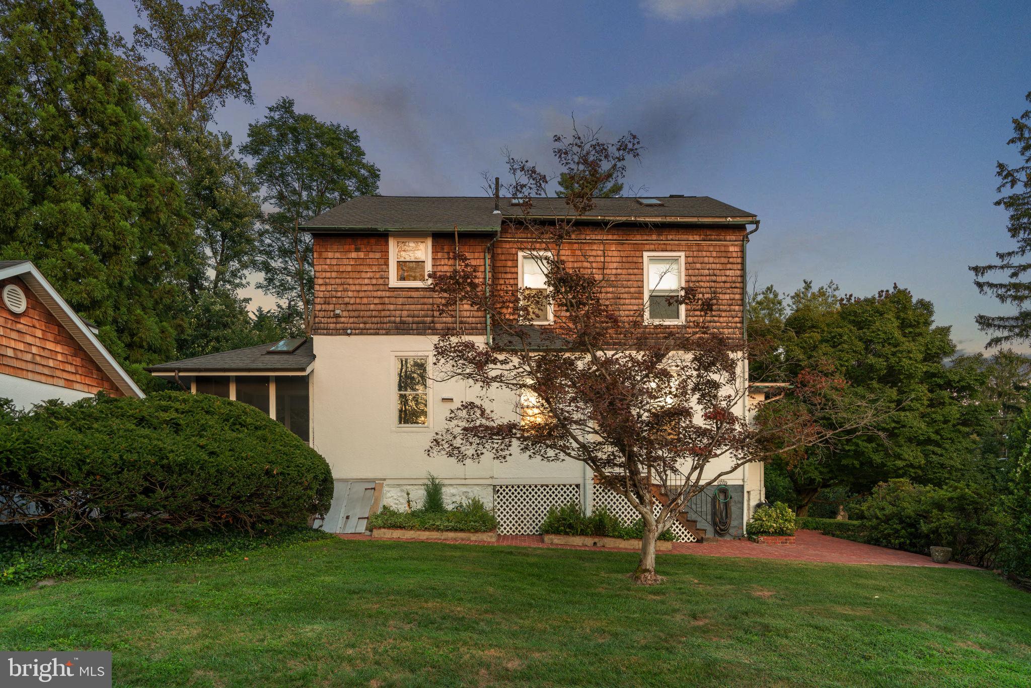 100 North Rolling Road Baltimore, MD 21228 - Photo 54 of 74 a front view of a house with a garden