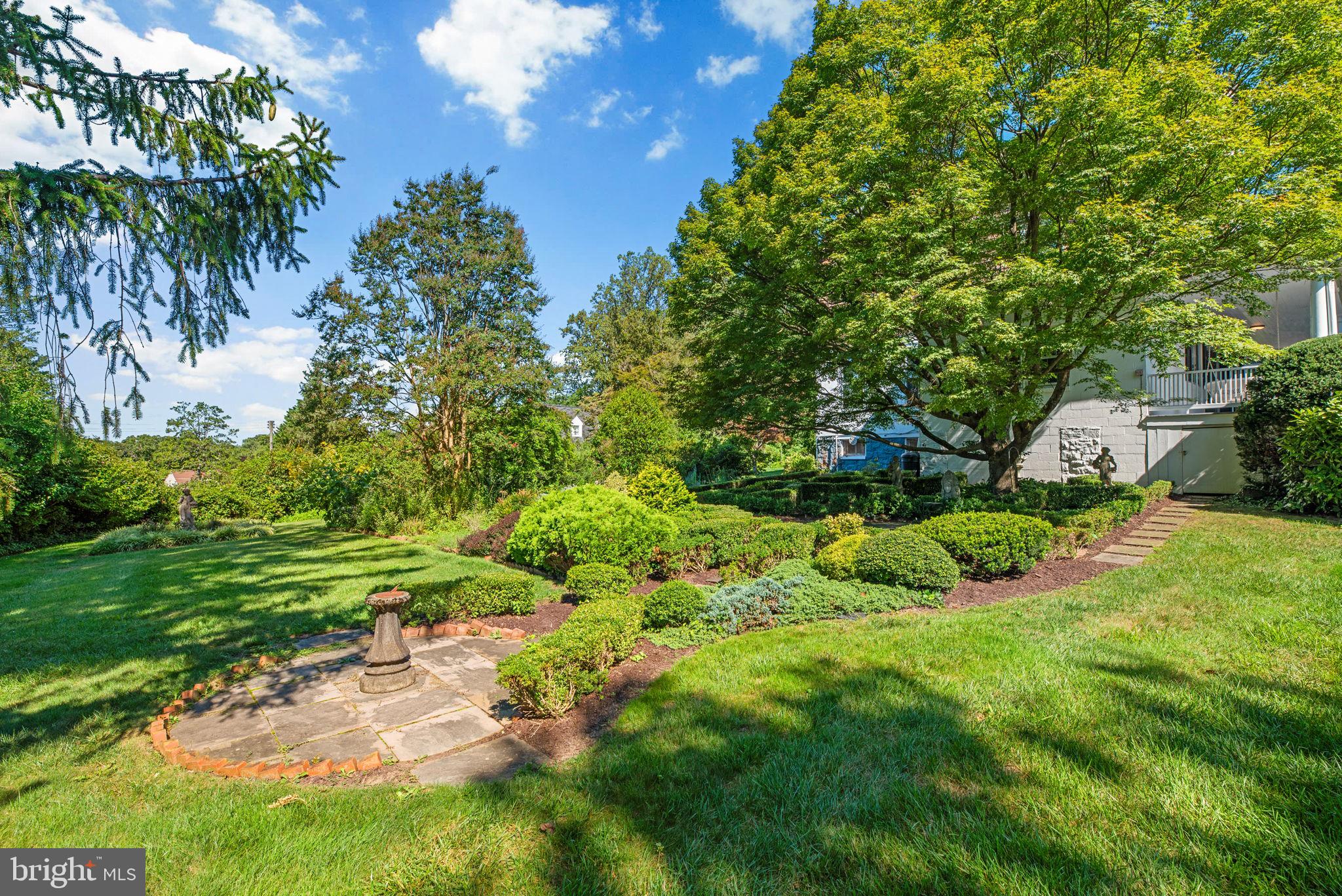 100 North Rolling Road Baltimore, MD 21228 - Photo 57 of 74 a view of a garden with a tree
