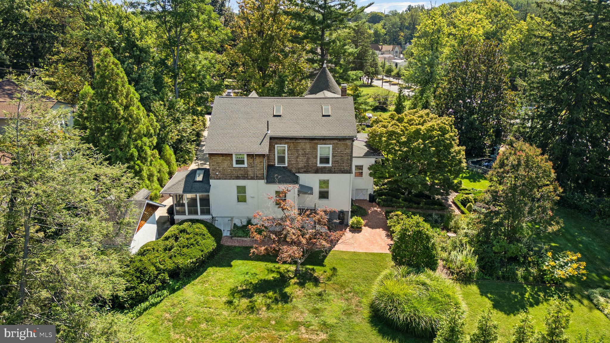 100 North Rolling Road Baltimore, MD 21228 - Photo 65 of 74 an aerial view of a house with a yard and garden