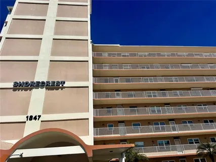 a view of a large building with a balcony