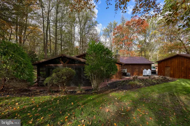 a view of a house with a yard and garage